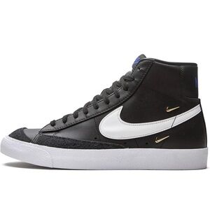 Nike Women's Black and White Sneakers with Gold Accents